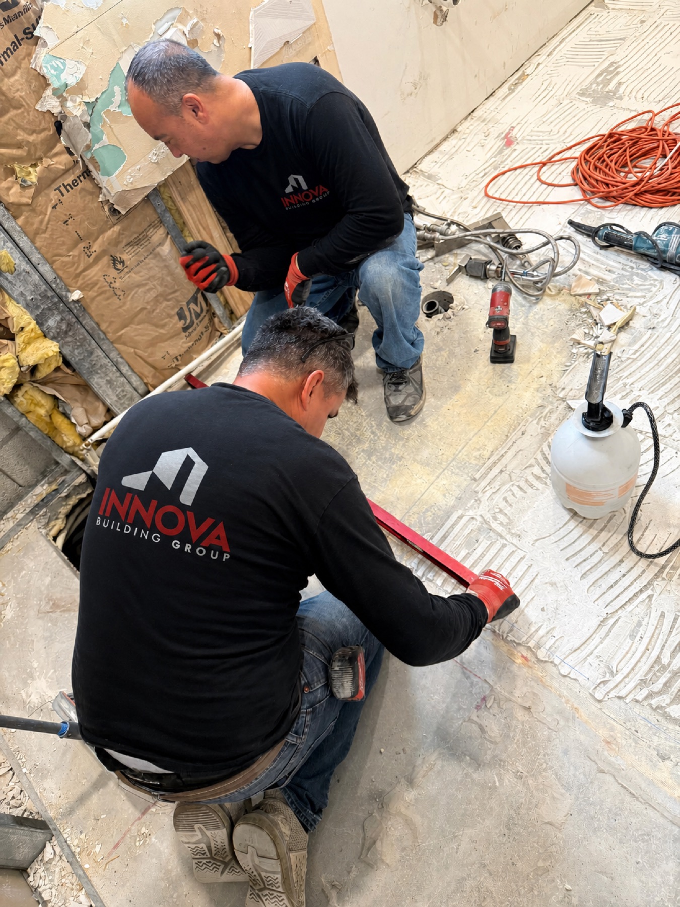 Innova crew installing flooring