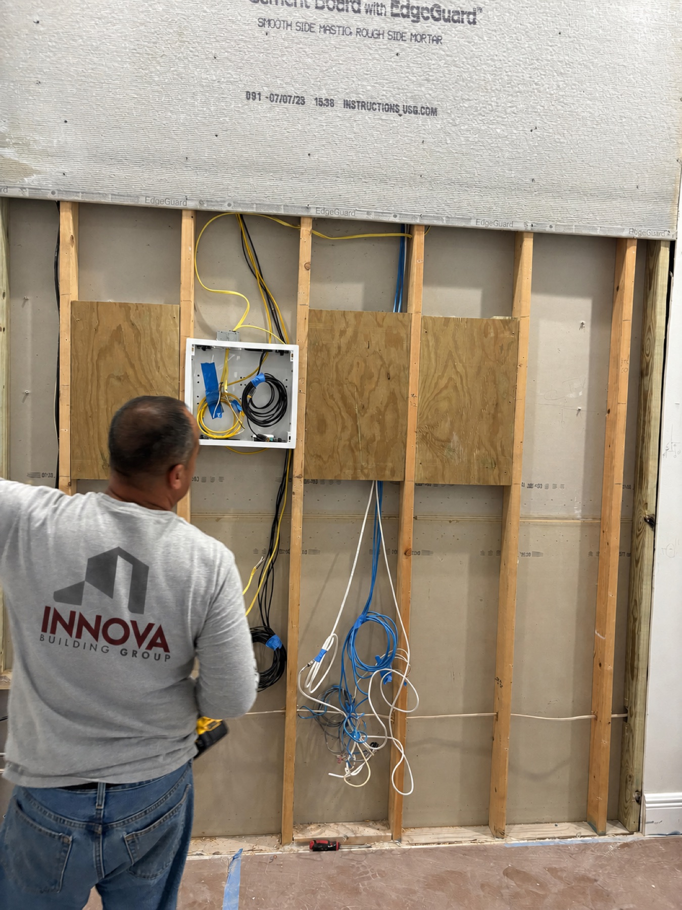 Innova team member inspecting framing
